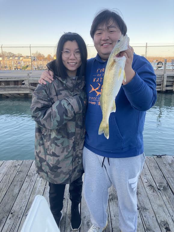 Clients Nina and Frank with one of four walleye they caught on the fall walleye fishing charter.